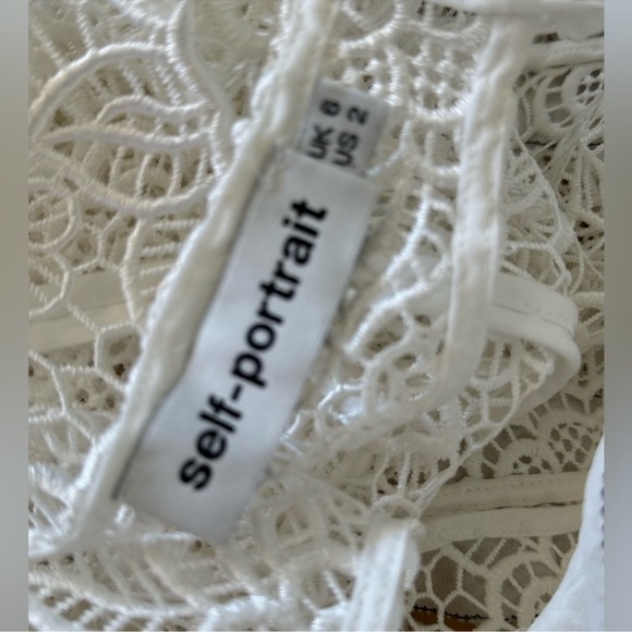 SELF-PORTRAIT White Cutout Ruffle Guipure
Lace Top Blouse Size: US 2 - Picture 5 of 5